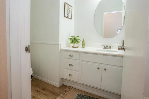 a hallway with sliding door and staircase