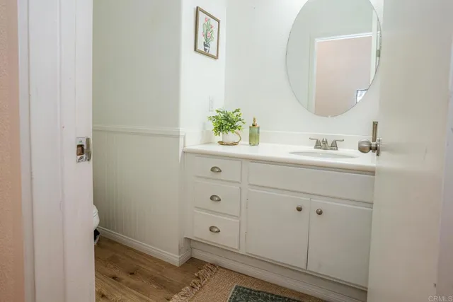 a hallway with sliding door and staircase