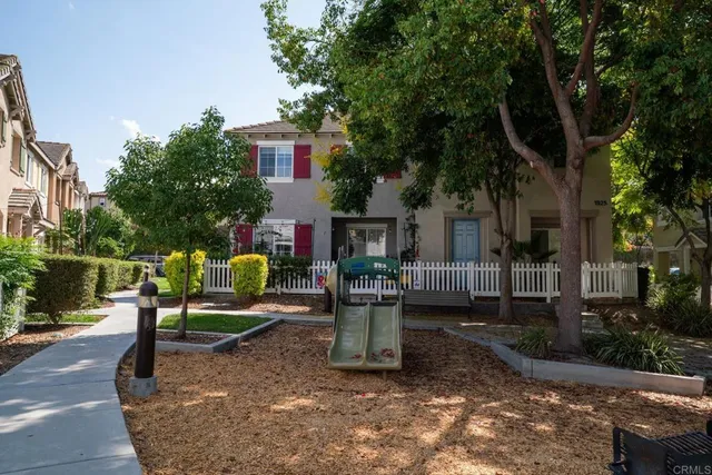 a view of a two chair and tables in the patio