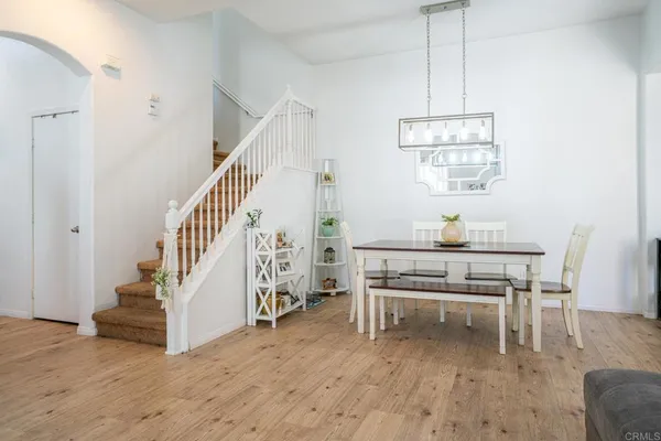 a kitchen with cabinets appliances a sink and a window