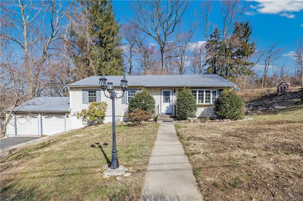 73 Ceil Road Trumbull, CT 06611 - Photo 1 of 1 a front view of a house with a yard