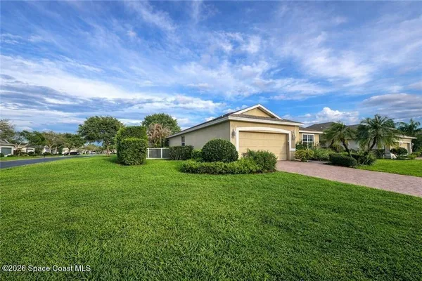 a view of a big yard next to a house