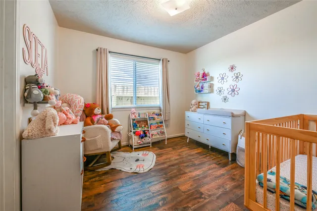 a room with furniture and wooden floor