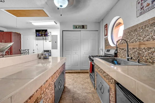 a bathroom with a sink vanity tub and shower