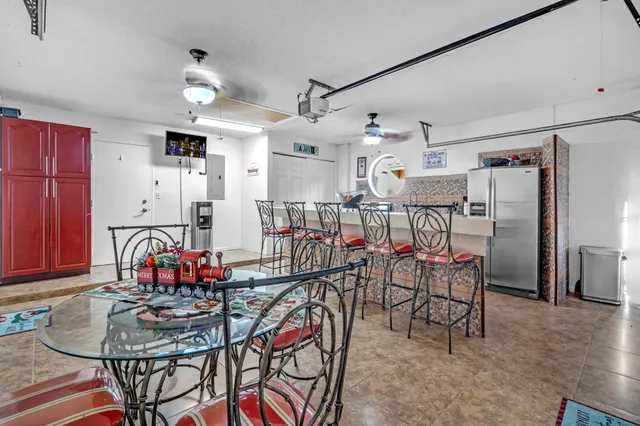 a room with a mirror a sink and a wooden floor