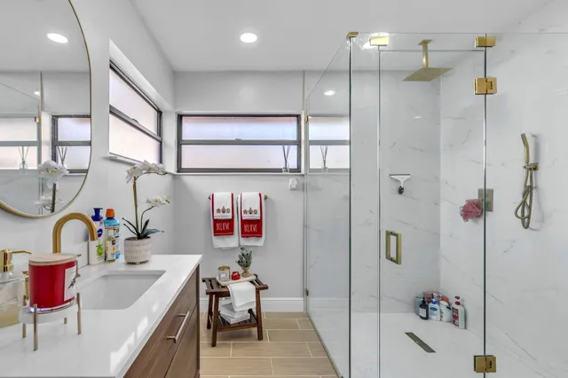 a bedroom with furniture and a flat screen tv