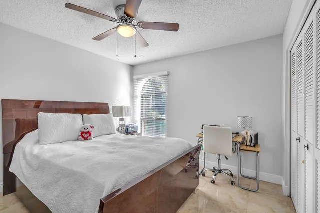 a bedroom with a bed and a walk in closet