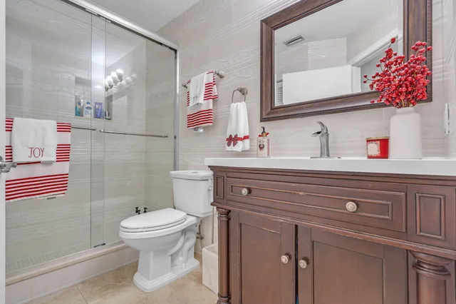 a kitchen with kitchen island granite countertop a sink stove and cabinets