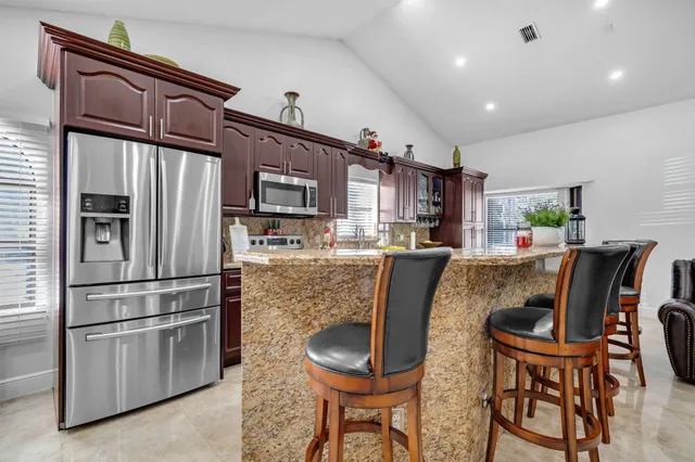 a view of a backyard with sitting area