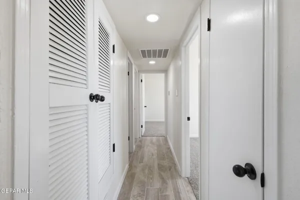 a bed room with a bed furniture and a potted plant