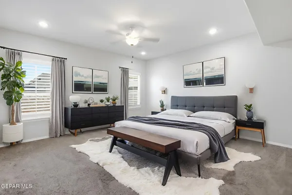 a bedroom with a bed and a view of kitchen