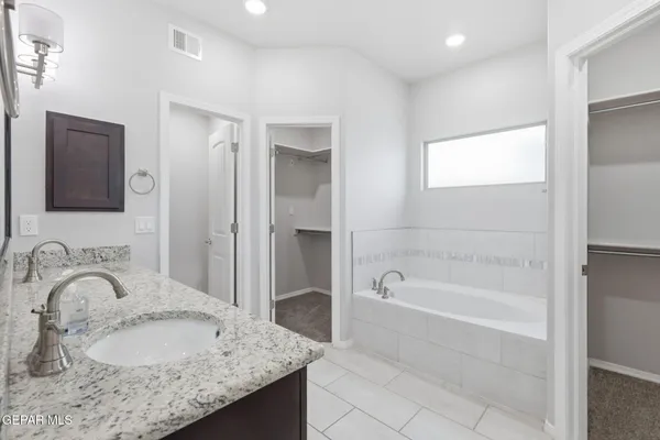 a white bath tub sitting in a bathroom