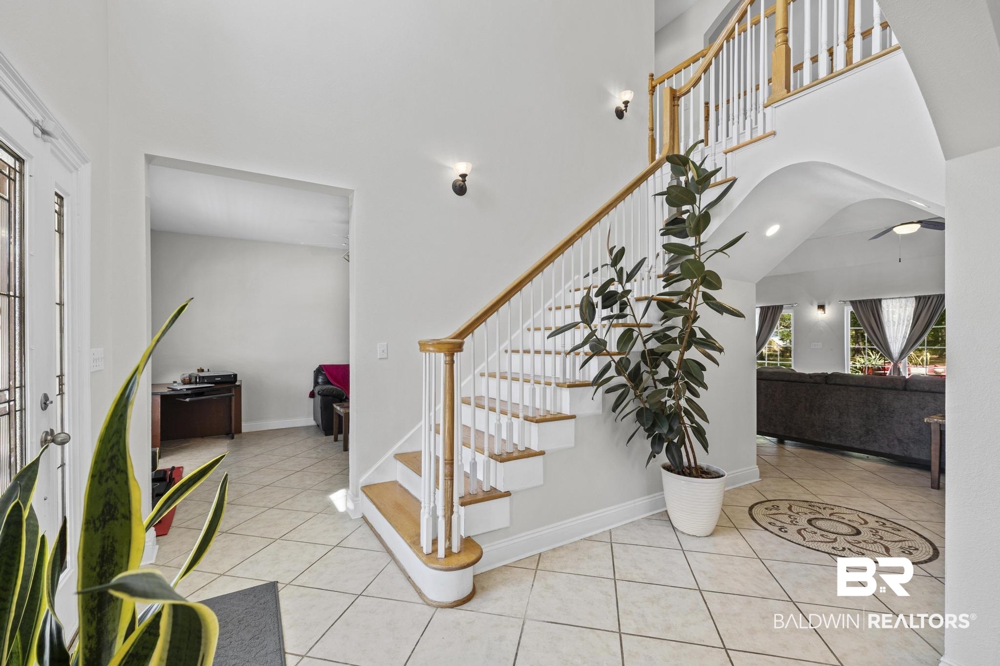 32875 Faircloth Road Lillian, AL 36549 - Photo 15 of 85 Foyer entrance featuring light tile patterned floors and a high ceiling