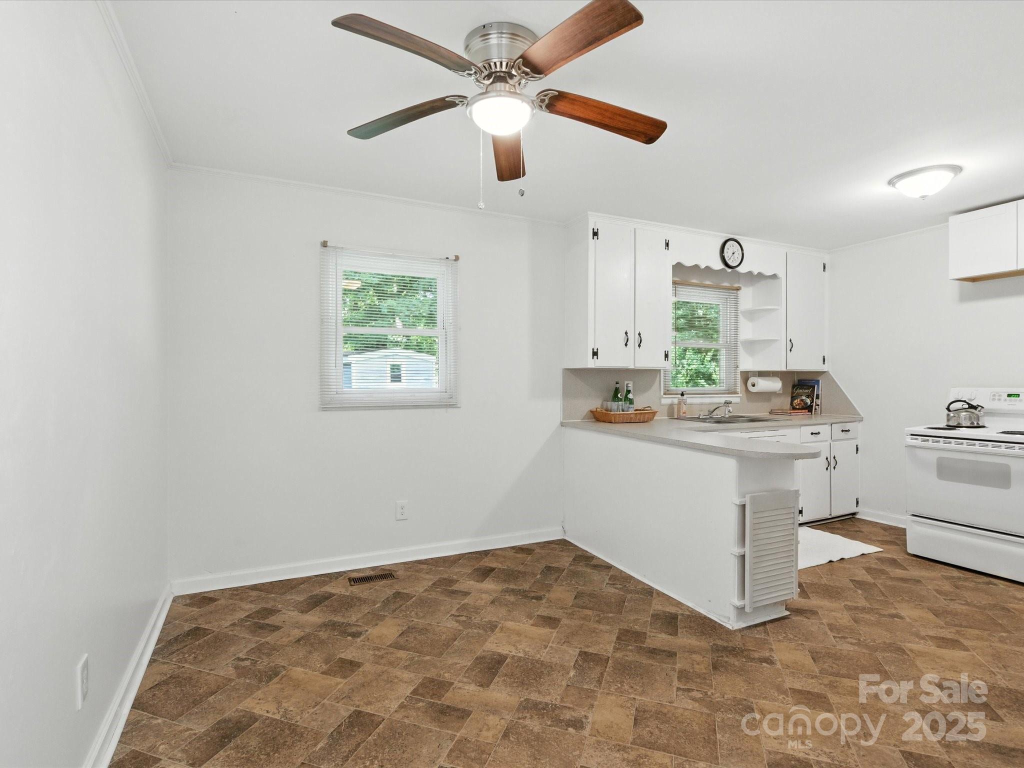 308 Taylor Drive Stanley, NC 28164 - Photo 13 of 26 a room with a chandelier furniture and a window