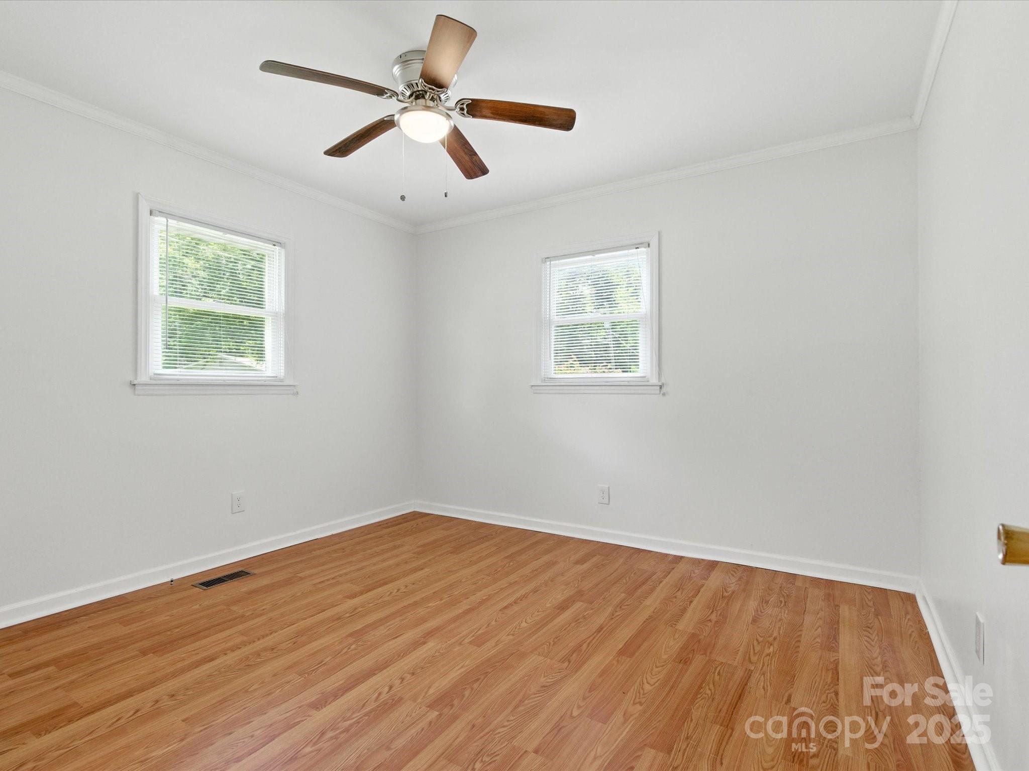 308 Taylor Drive Stanley, NC 28164 - Photo 19 of 26 a view of empty room with wooden floor