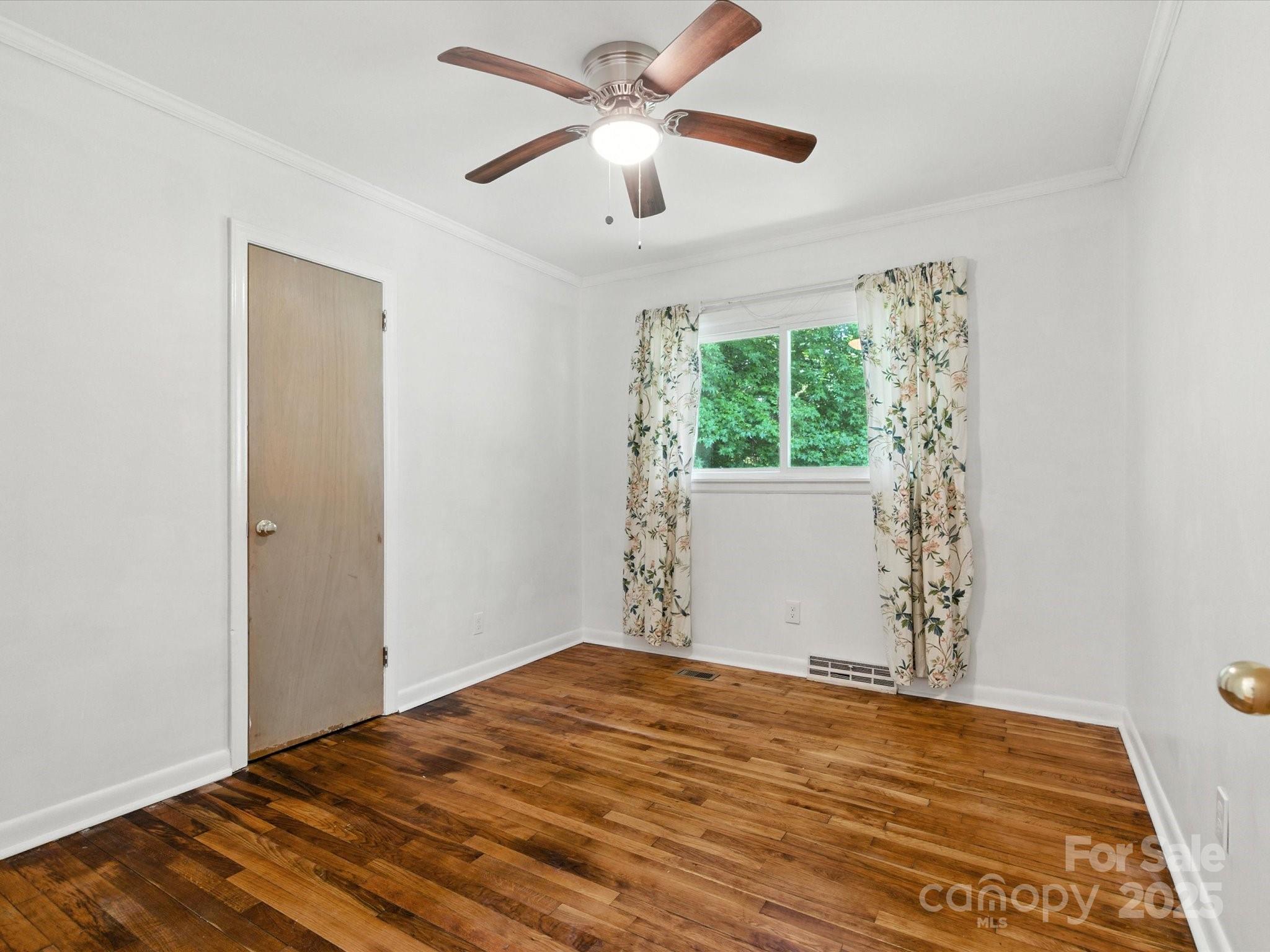 308 Taylor Drive Stanley, NC 28164 - Photo 20 of 26 a view of a room with a ceiling fan and a window