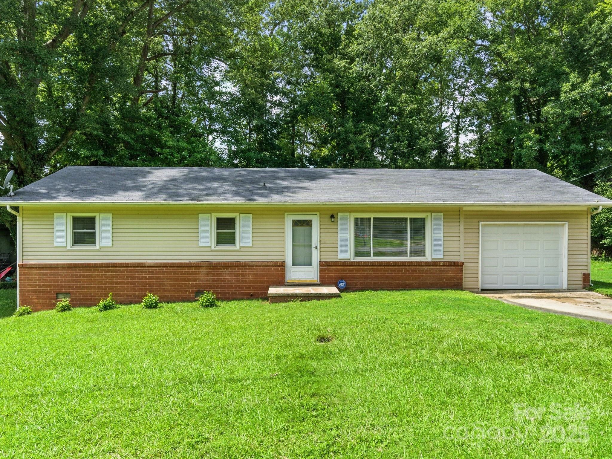 308 Taylor Drive Stanley, NC 28164 - Photo 2 of 26 a view of a house with a yard and sitting area