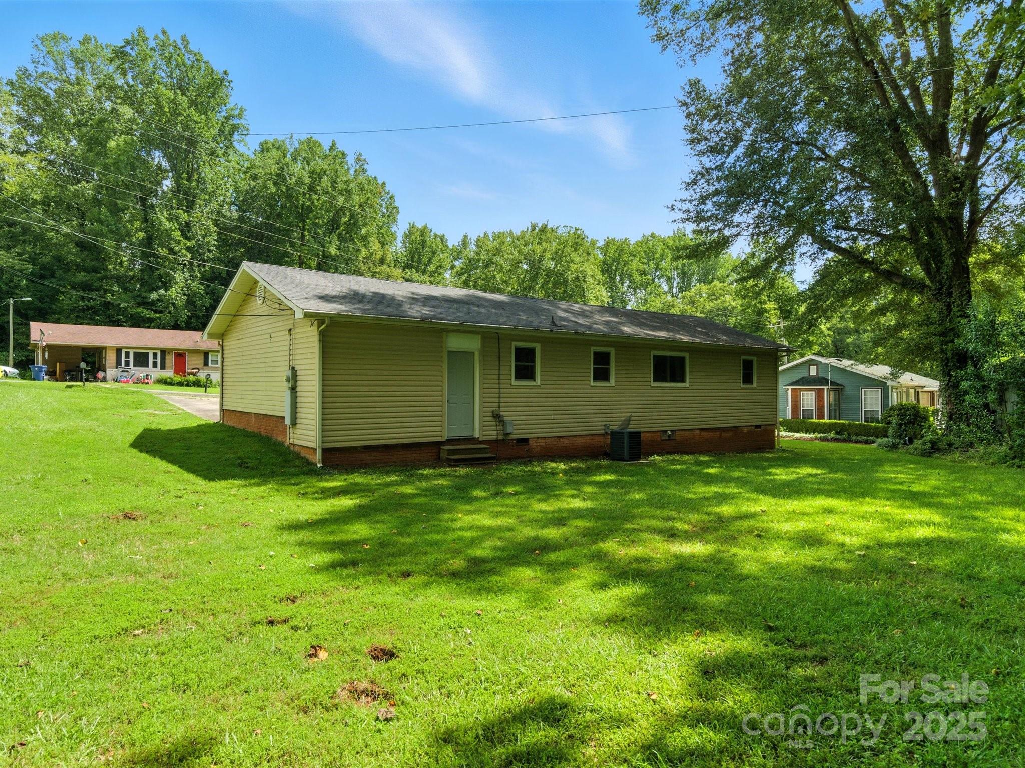 308 Taylor Drive Stanley, NC 28164 - Photo 24 of 26 a view of a backyard with a garden