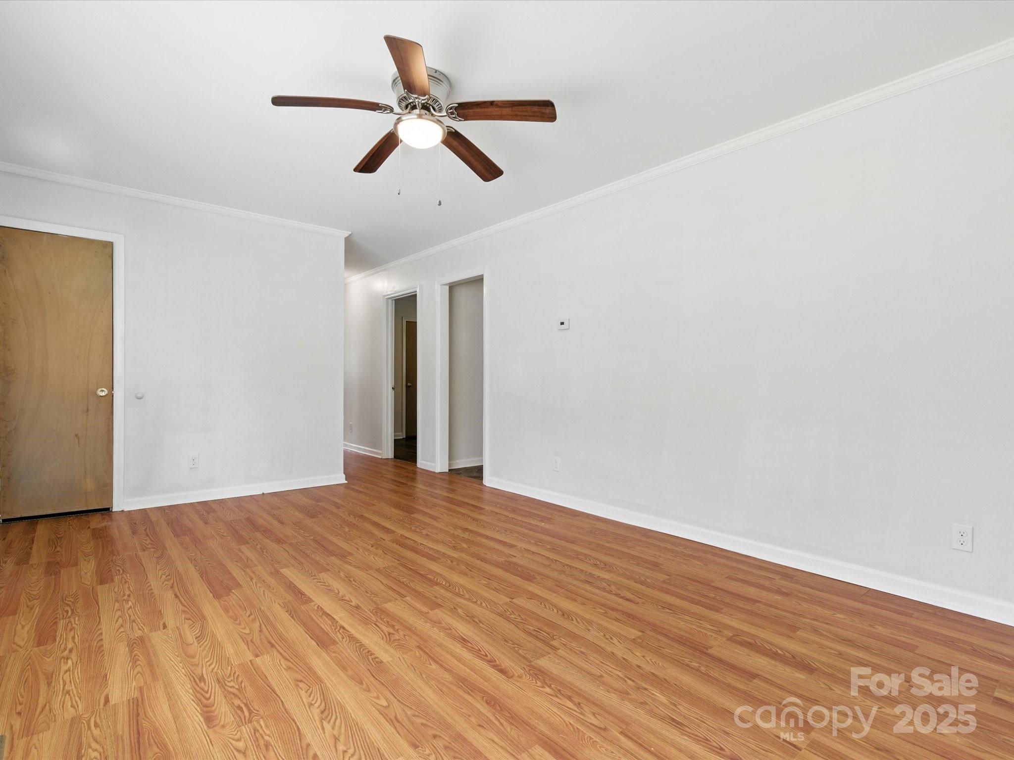 308 Taylor Drive Stanley, NC 28164 - Photo 5 of 26 a view of room with wooden floor and ceiling fan