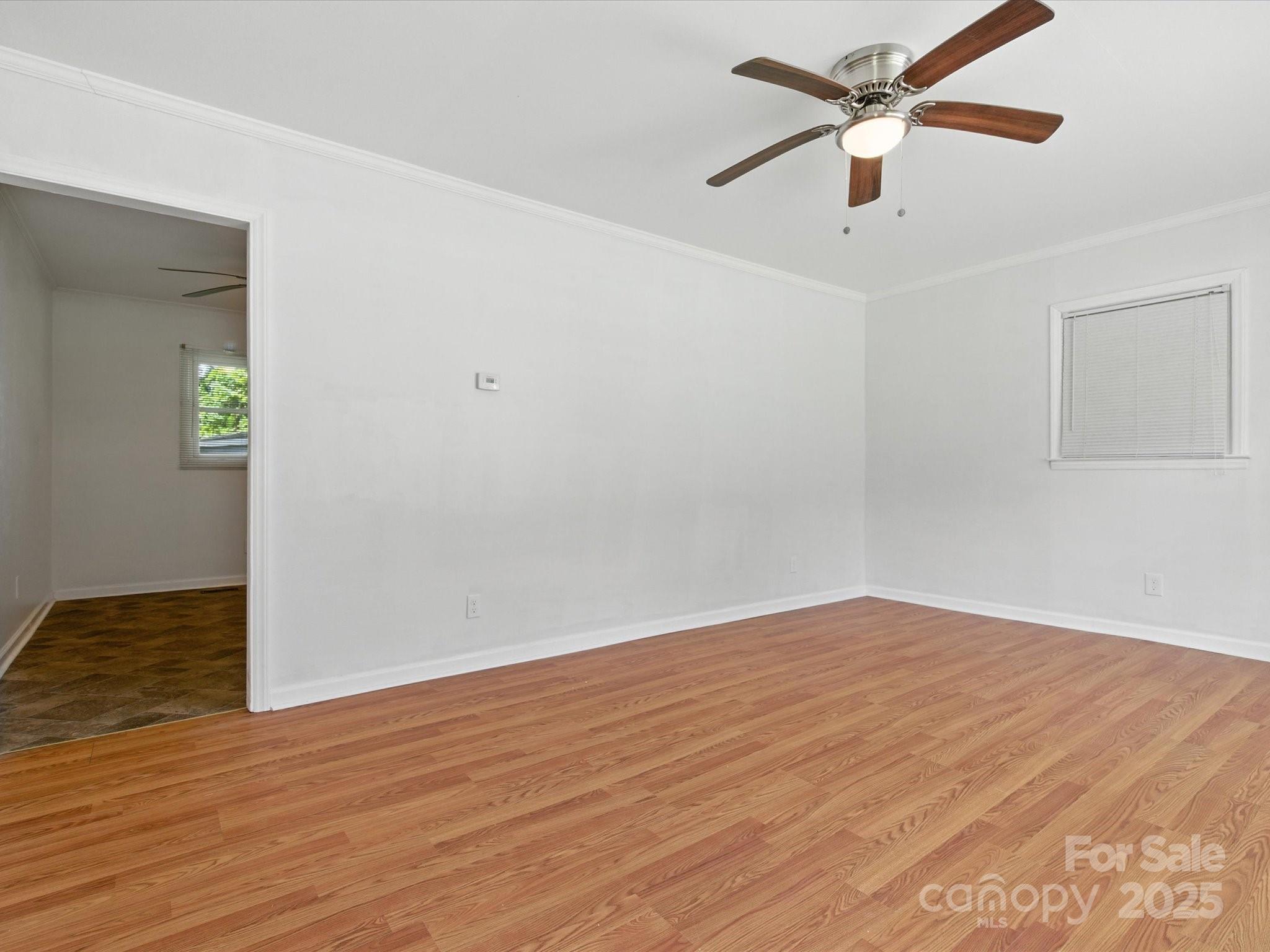 308 Taylor Drive Stanley, NC 28164 - Photo 6 of 26 a view of an empty room with wooden floor