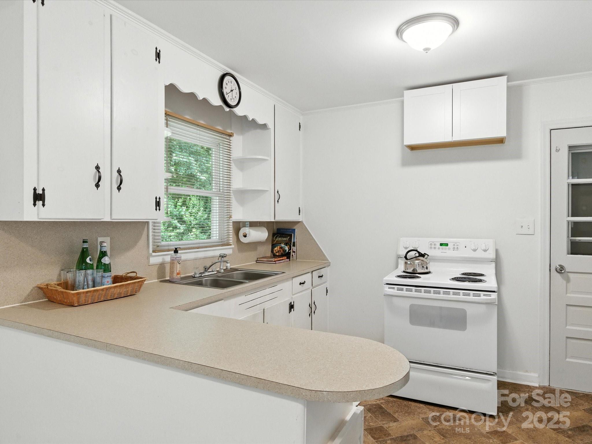 308 Taylor Drive Stanley, NC 28164 - Photo 8 of 26 a kitchen with a sink cabinets and window