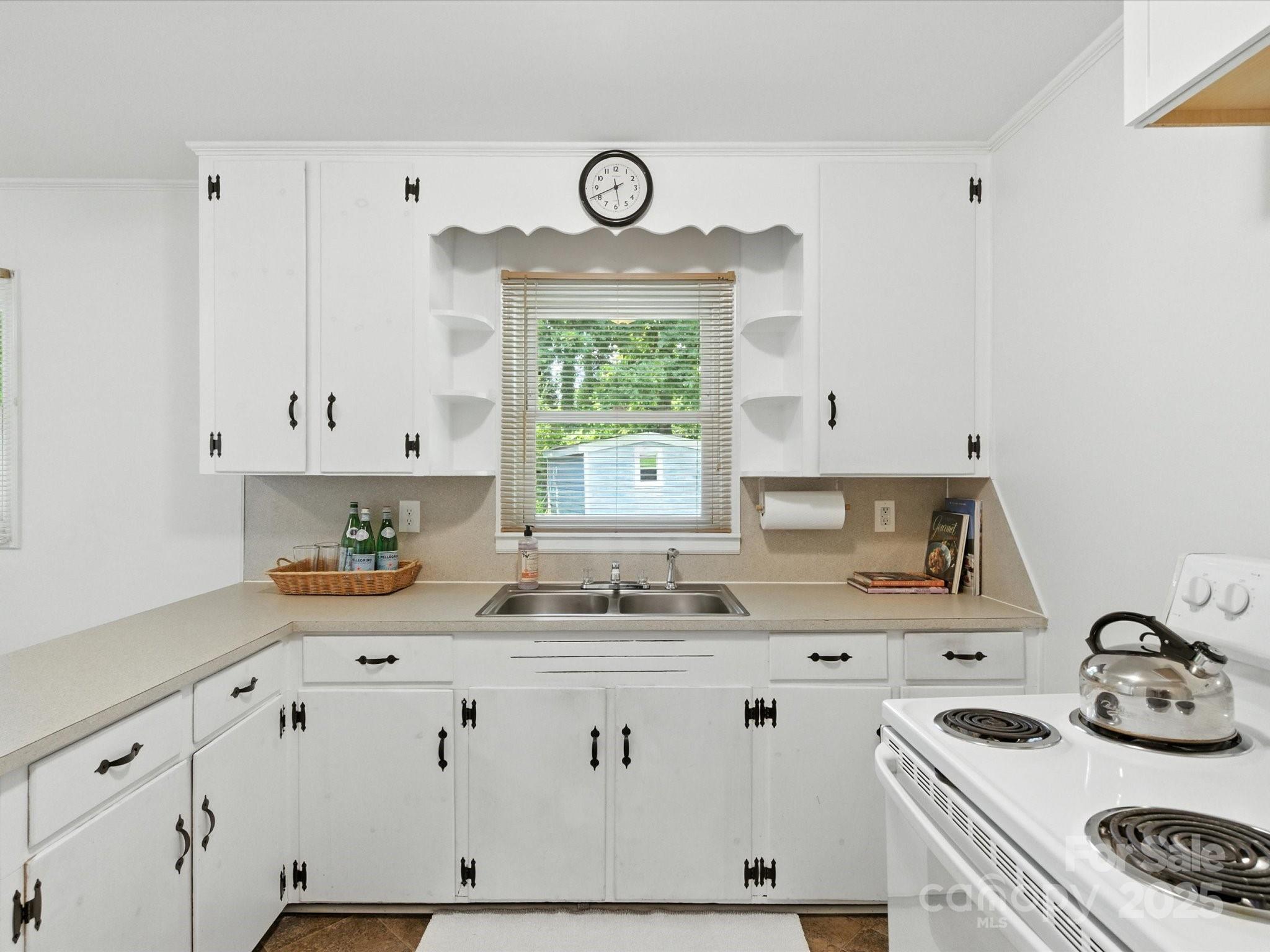 308 Taylor Drive Stanley, NC 28164 - Photo 9 of 26 a kitchen with granite countertop a sink a stove and cabinets
