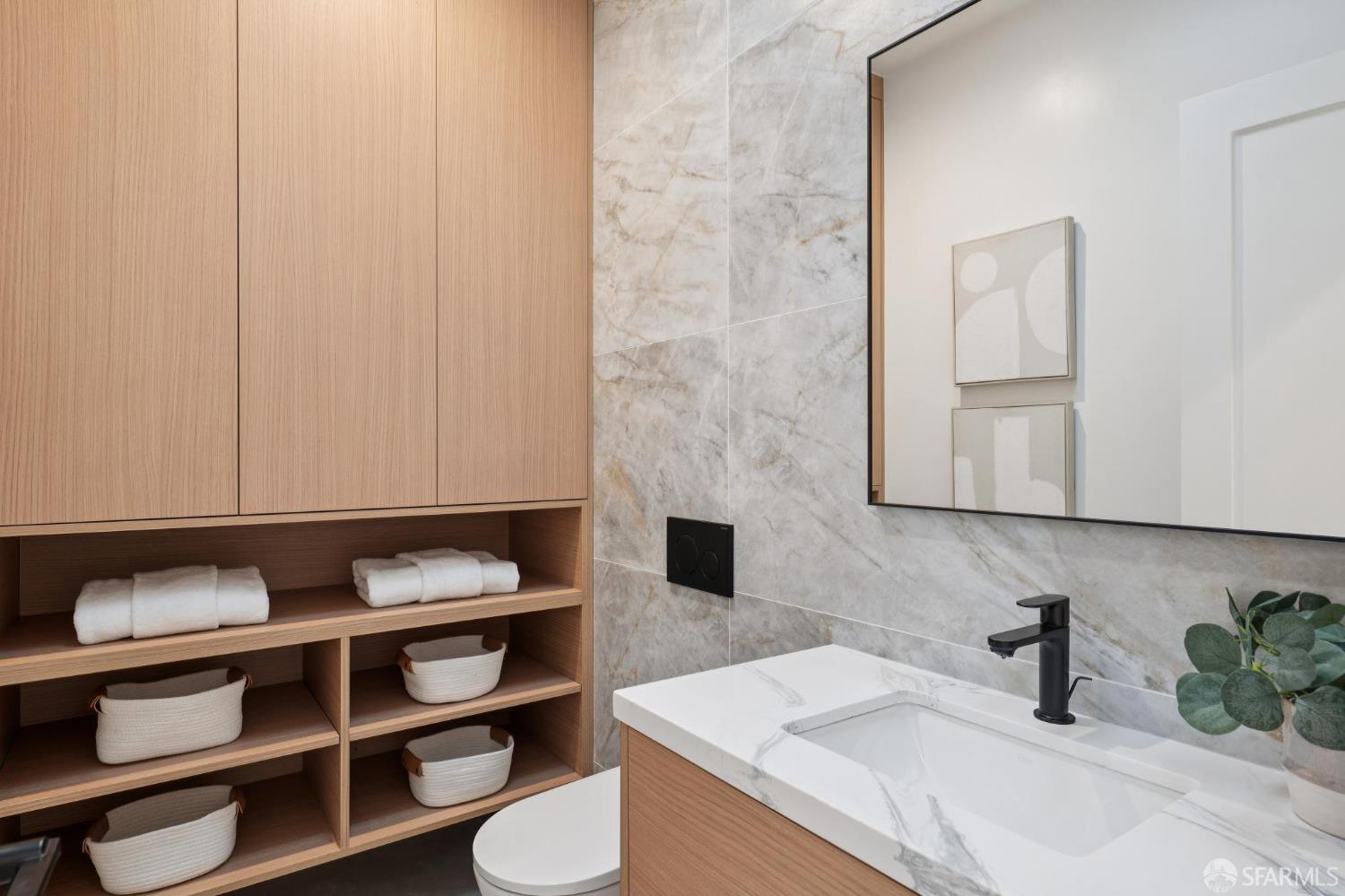 1726 30th Avenue San Francisco, CA 94122 - Photo 11 of 34 a bathroom with a sink and a mirror