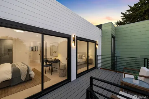 a view of sitting area with furniture and balcony