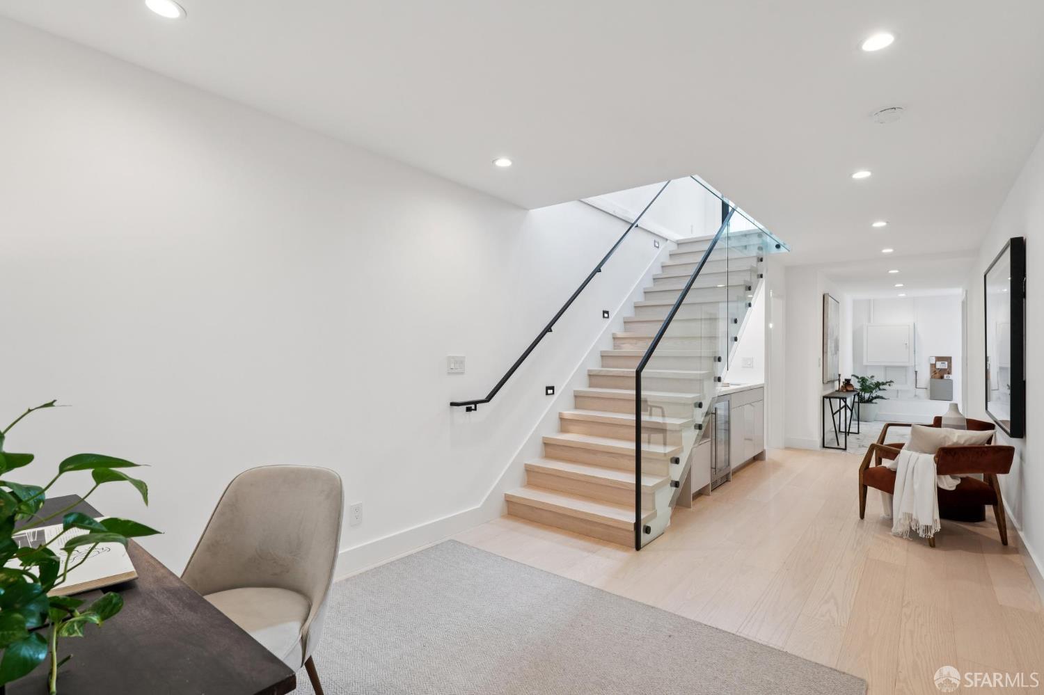1726 30th Avenue San Francisco, CA 94122 - Photo 21 of 34 a living room with furniture and stairs