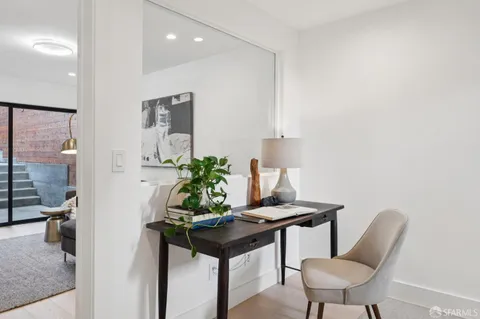 a view of a workspace with furniture