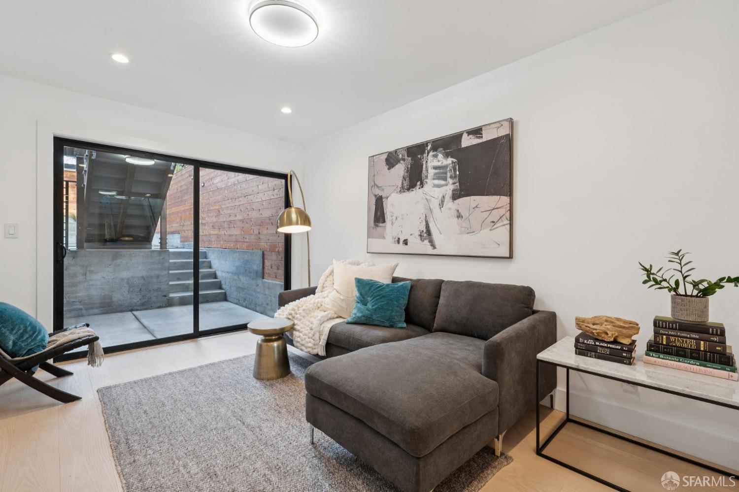 1726 30th Avenue San Francisco, CA 94122 - Photo 24 of 34 a living room with furniture and a glass door