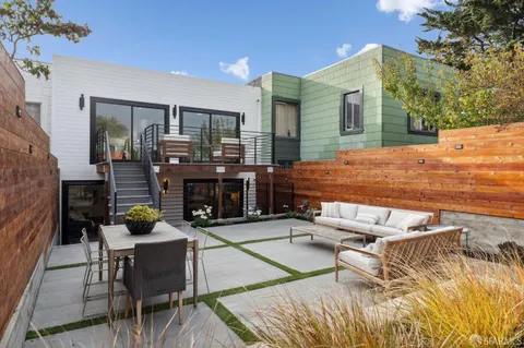 a view of sitting area with furniture and city view
