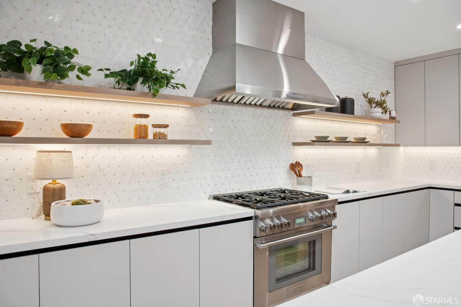 1726 30th Avenue San Francisco, CA 94122 - Photo 7 of 34 a kitchen with stainless steel appliances granite countertop a sink stove and cabinets