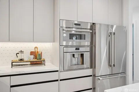 a kitchen with appliances and cabinets