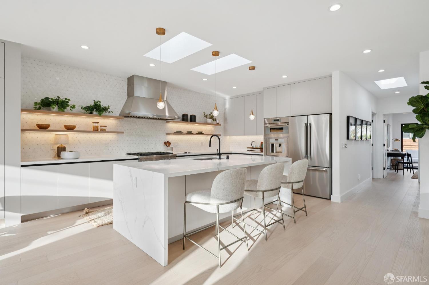 1726 30th Avenue San Francisco, CA 94122 - Photo 10 of 34 a kitchen with stainless steel appliances kitchen island granite countertop a refrigerator and microwave