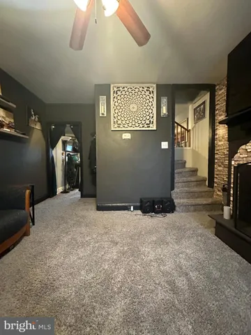 a view of an empty room with a fireplace