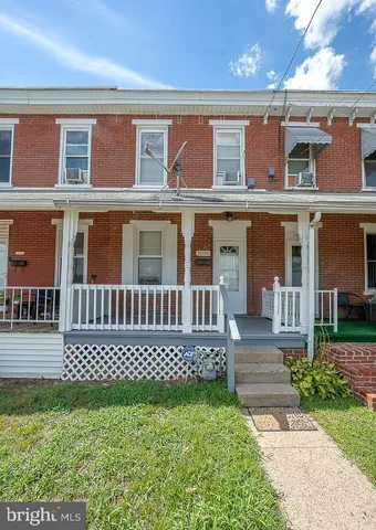 front view of a house with a small yard