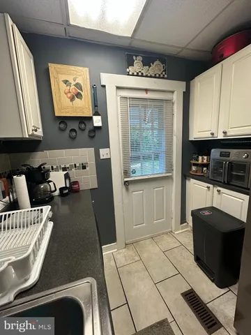 a kitchen with a cabinets and window