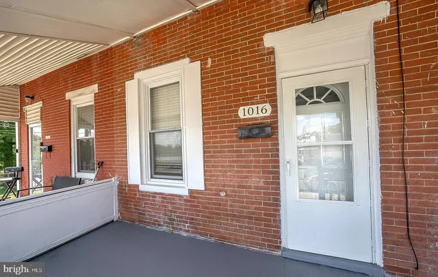 a view of a brick house with windows
