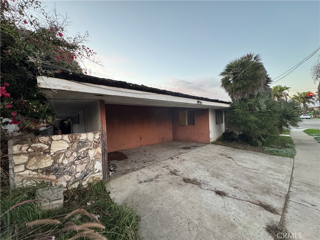 16591 Channel Huntington Beach, CA 92649 - Photo 6 of 11 a house with a tree in front of it
