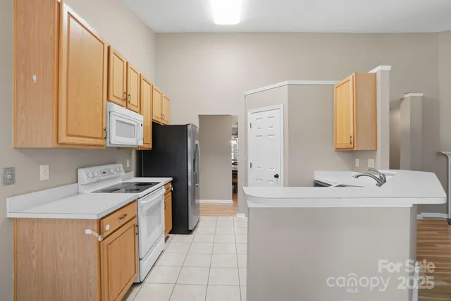 a utility room with cabinets a washer and dryer