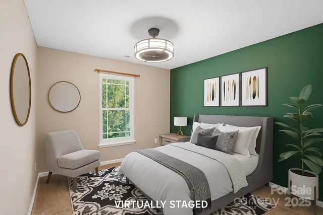 a bedroom with a bed furniture and a window