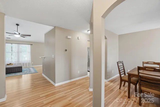 a view of a livingroom with furniture and wooden floor