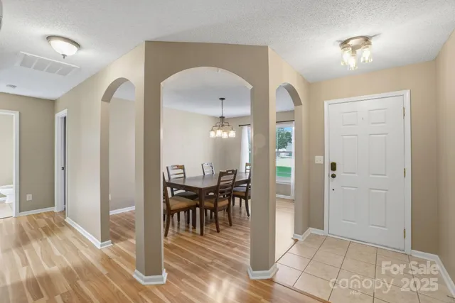 a view of a livingroom with furniture and entryway