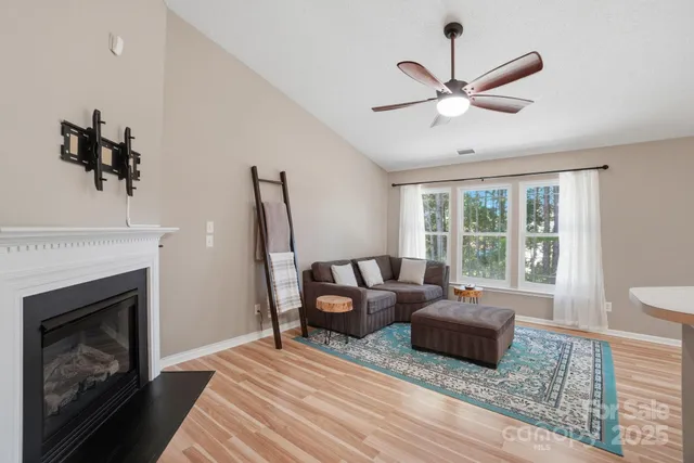 a bedroom with furniture and a fireplace