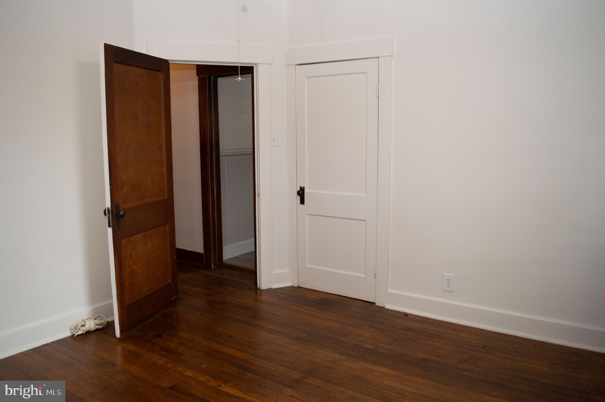 West Water Street Smithsburg, MD 21783 - Photo 16 of 23 an empty room with wooden floor and closet