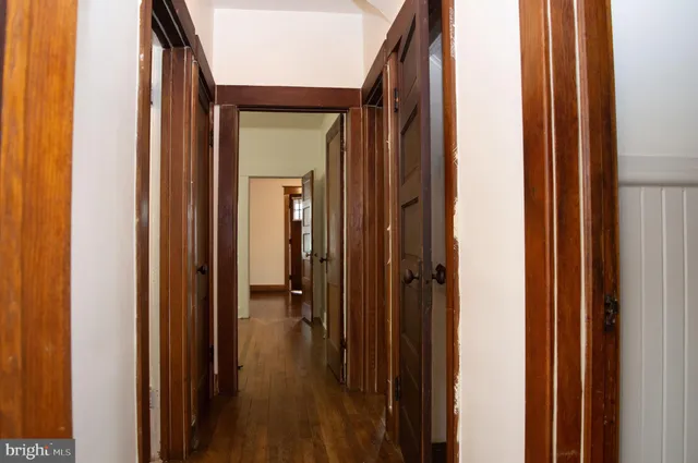 a view of a bathroom from a hallway