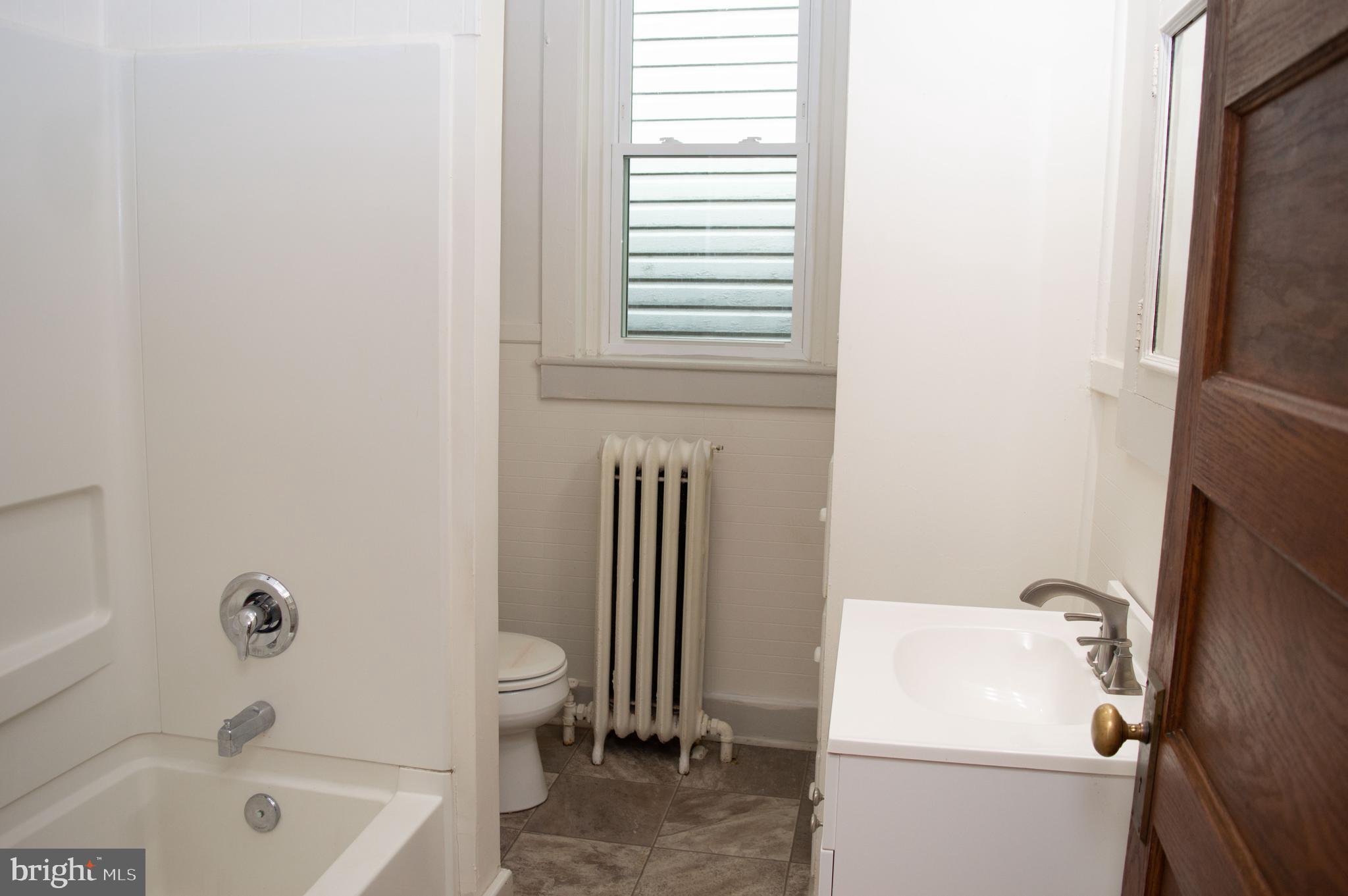 West Water Street Smithsburg, MD 21783 - Photo 18 of 23 a bathroom with a sink a toilet and a bathtub