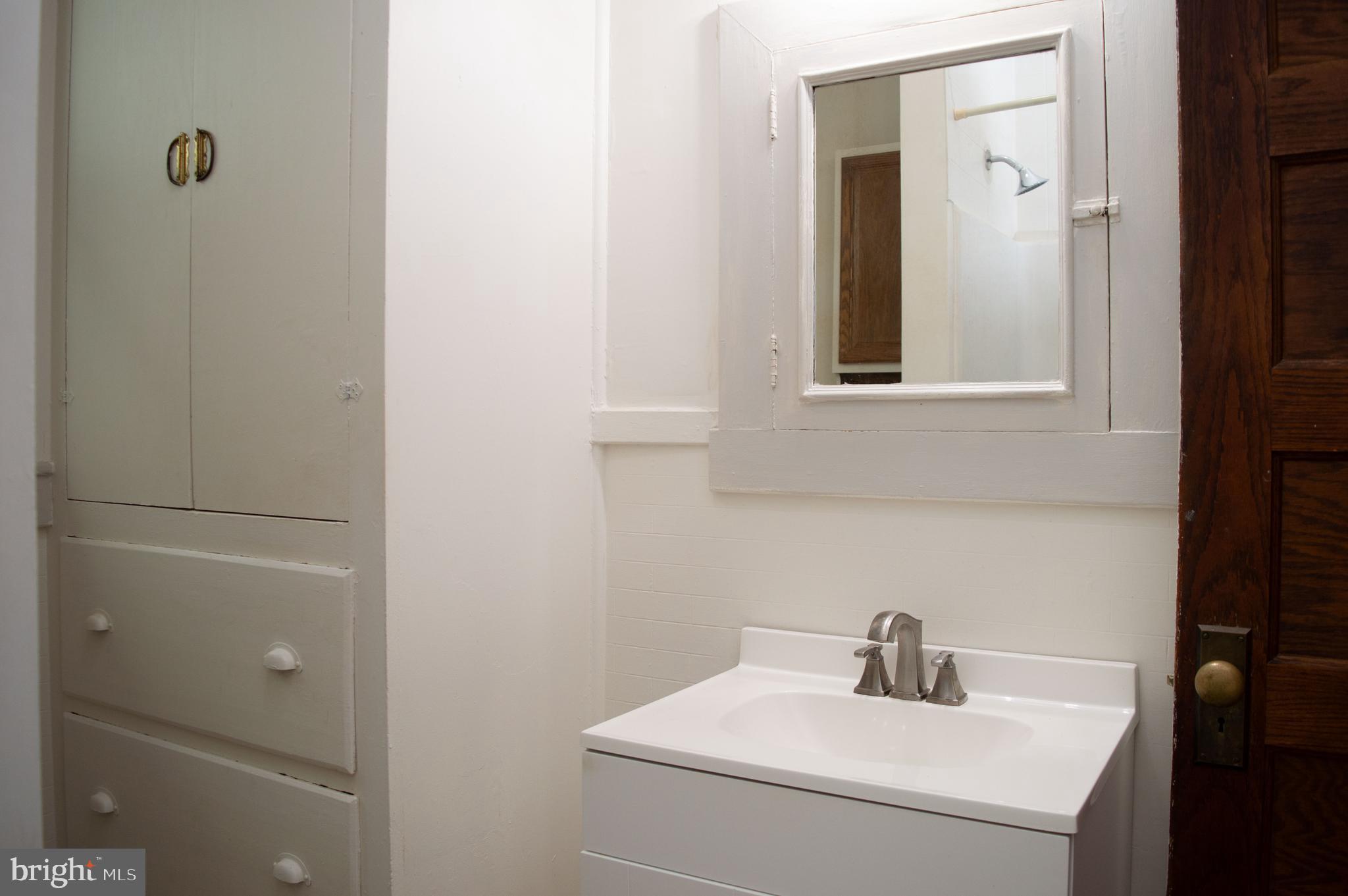 West Water Street Smithsburg, MD 21783 - Photo 19 of 23 a bathroom with a sink and mirror