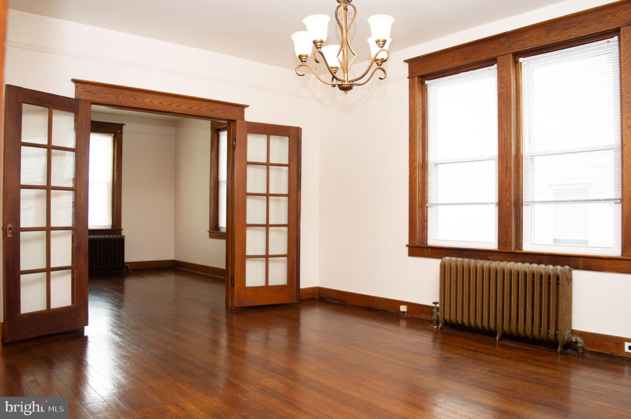 West Water Street Smithsburg, MD 21783 - Photo 7 of 23 a view of an empty room with wooden floor and a window